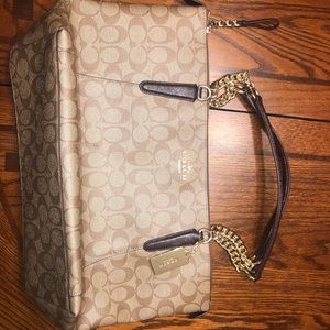 A brown and gold limited AVA Chain signature tote.